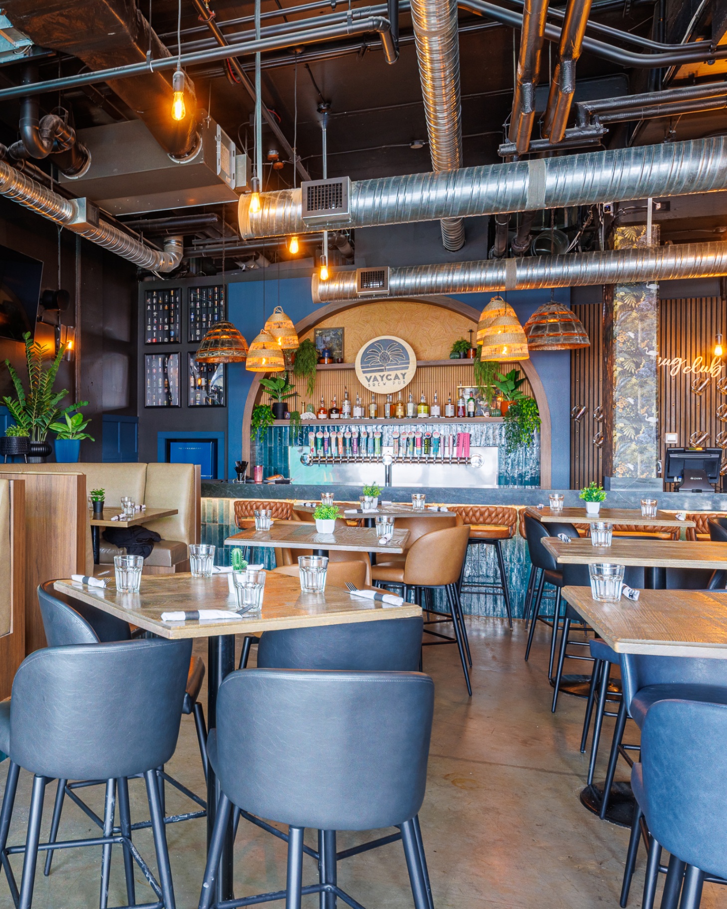 Downstairs dining room with booths and high tops